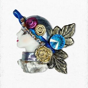 6378. Silvertone Clay Brooch Ladyface